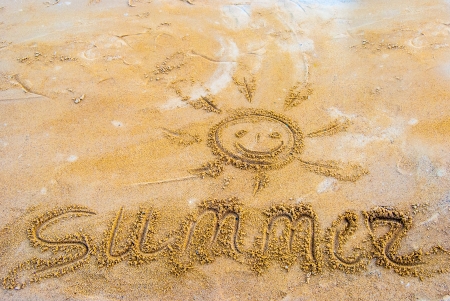 drawing on sandy beach, smile and sunの写真素材