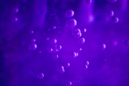 purple bubbles in ice illuminated at night