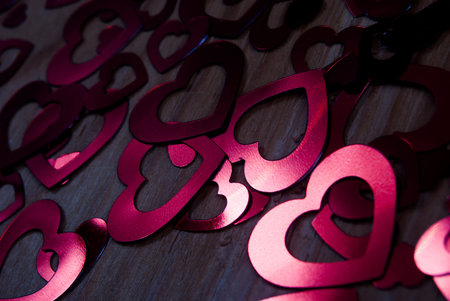 many glittering hearts on wood