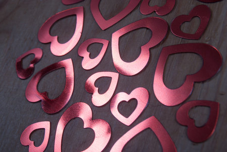 many glittering hearts on wood