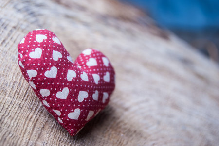 red heart on woodの写真素材