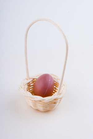 wooden egg in a basketの写真素材