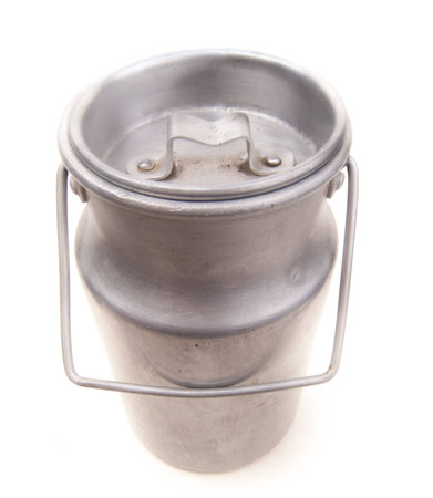 vintage aluminium drum for milk isolated on whiteの写真素材