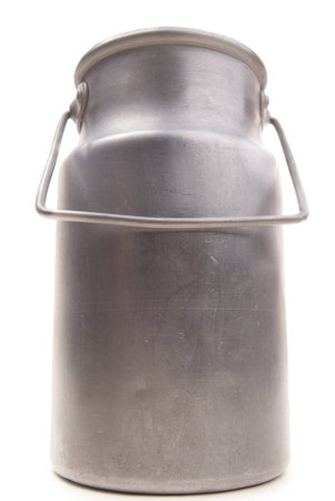 vintage aluminium drum for milk isolated on whiteの写真素材