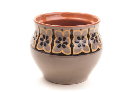 opened vintage ceramic pot isolated on whiteの写真素材