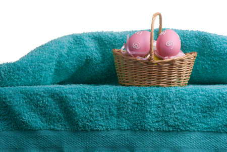 Easter decoration. Background with eggs and Turkish towel isolated on white with space for text.の写真素材