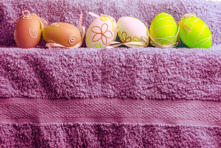Easter decoration. Background with eggs and Turkish towel with space for text.