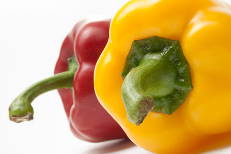 Red and Yellow Bell Peppers on a white background