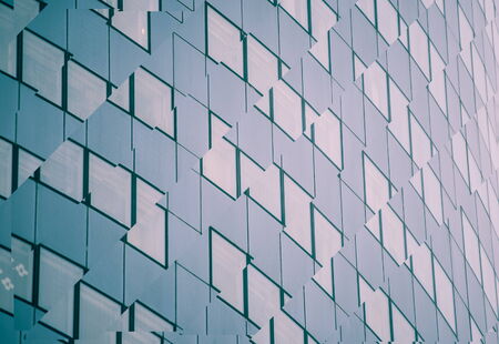 digitally transformed photo of modern office building. Business background.の写真素材