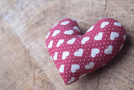 red heart on woodの写真素材