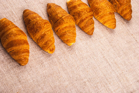 Croissants on rough fabric shot from aboveの写真素材