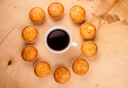 Close-up of cupcakes on wooden board.の写真素材