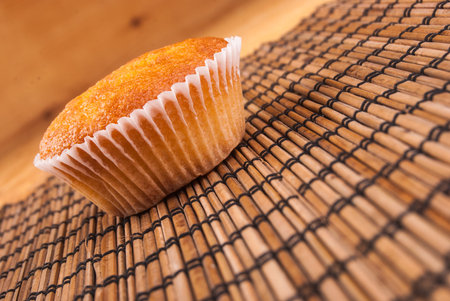 Close-up of cupcakes on wooden board.