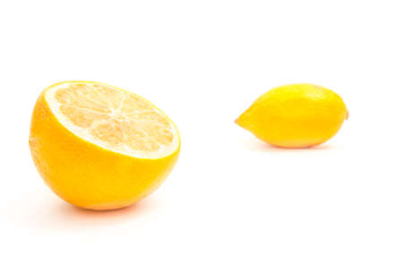 yellow lemon and slice isolated on whiteの写真素材