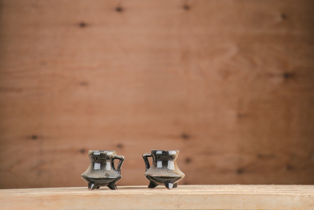 vintage ceramic pot on woodの写真素材