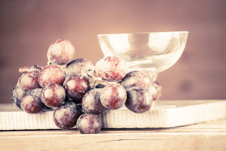 wine grapes on a wooden backgroundの写真素材