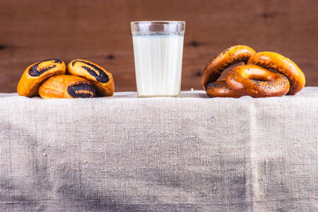 Rural kitchen scene. Breakfast on burlap against wood.の写真素材