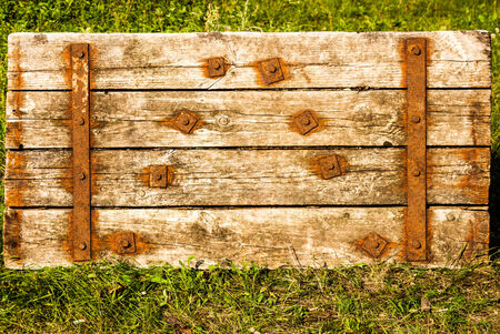 Old Shabby Wooden Planks with rusted bolts, grungy background textureの写真素材