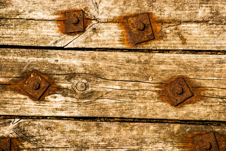 Old Shabby Wooden Planks with rusted bolts, grungy background texture
