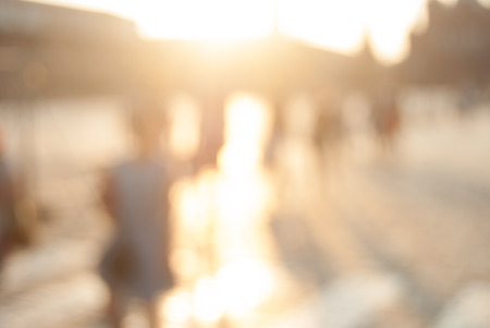 City commuters. High key blurred image of workers going back home after work. Unrecognizable faces, bleached effect.の写真素材