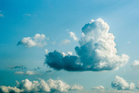 Beautiful big clouds in serence blue sky on a bright dayの写真素材