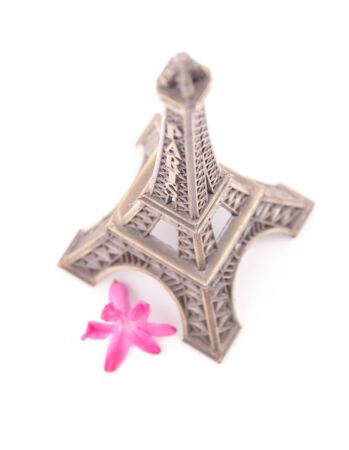 Eiffel tower with pink flower isolated on white backgroundの写真素材