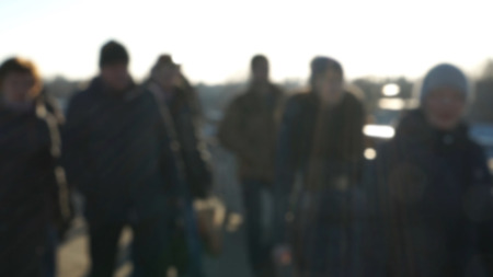 City commuters. Blurred image of workers going back home after work. Unrecognizable faces, bleached effect.の写真素材