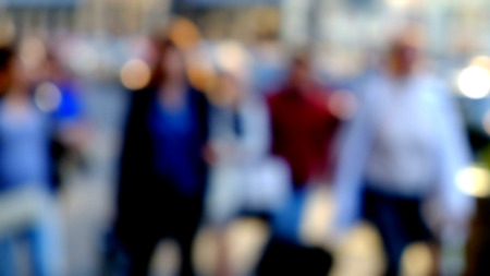 City commuters. Blurred image of workers going back home after work. Unrecognizable faces, bleached effect.の写真素材