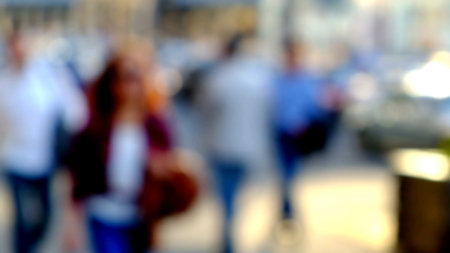 City commuters. Blurred image of workers going back home after work. Unrecognizable faces, bleached...