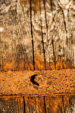 Old Shabby Wooden Planks with rusted bolts, grungy background textureの写真素材