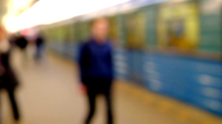 People walking on train station, blurred backgroundの写真素材