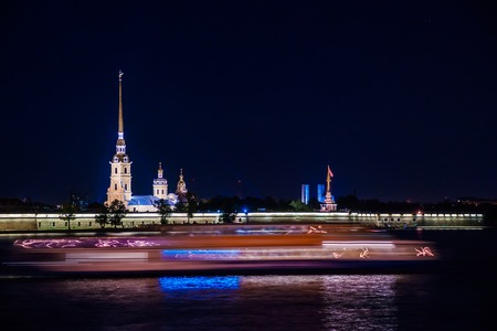 Beautiful night view of Cathedral of Peter and Pavel in Petropalovskaya fortress. Prominent russian landmarks with colorful night illumination. Saint-Petersburg, Russiaの写真素材