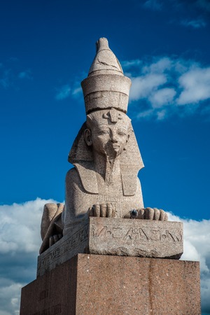 Authentic antique Egyptian sphynx on quay of the Neva river against cloudy sky in Saint-Petersburg, Russia. One of the prominent landmarks in Saint Petersburg.の写真素材