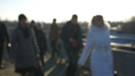 City commuters. Blurred image of workers going back home after work. Unrecognizable faces, bleached effect.の写真素材