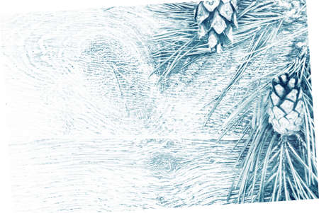 Christmas fir tree with cones on a wooden background, selective focus and place for text. Tonedの写真素材