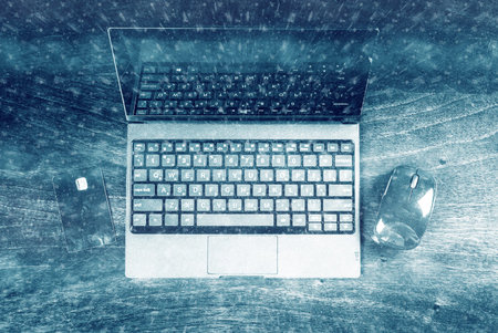 Black laptop on wood with Banking card. Image for internet shopping, electronic banking and web...