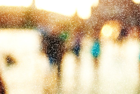 Winter city commuters with snow. Blurred image of workers going back home after work. Unrecognizable faces, bleached effect.の写真素材