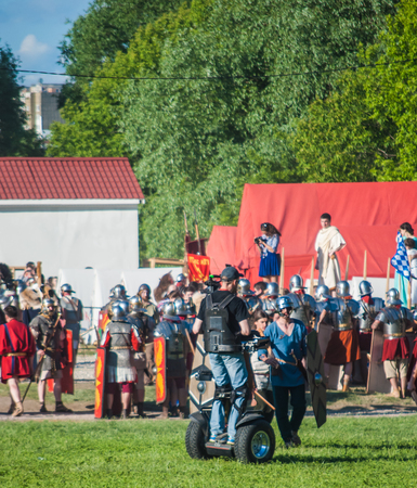 MOSCOW - JUNE 06, 2015: Cameraman on Steadiseg shooting historical reenactment in Kolomenskoye, Moscow. Steadiseg is easy way to capture smooth tracking shots at a fairly brisk pace.のeditorial素材