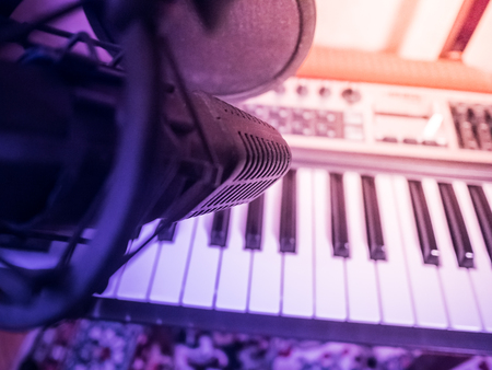 Electronic piano with keys in the foreground. Musical background image.の写真素材
