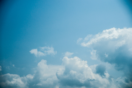 Clouds in the sky. Beautiful vintage photo with a vignette. Can be used as abstract background for different design projects.の写真素材