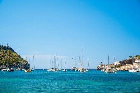 Puerto de Soller, Port of Mallorca island in balearic islands, Spain. Beautiful picture of boats in clear blue water of bright summer day.の写真素材