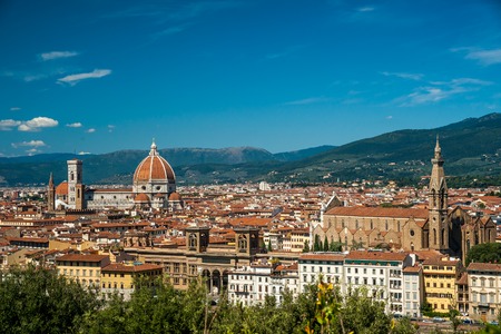 Cathedral of Santa Maria del Fiore in Florence, Italy. Beautiful cityscape image with red roofs of renaissance and medieval architecture.の写真素材