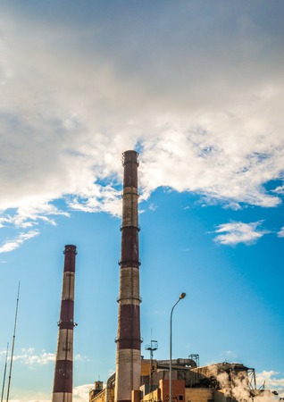 Coal Fossil Fuel Power Plant with Smokestacks, energy plant in sunset light.の写真素材