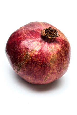 A pomegranate on a white backgroundの写真素材