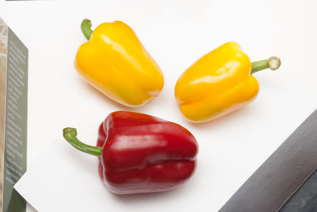 Red and Yellow Bell Peppers on a white background