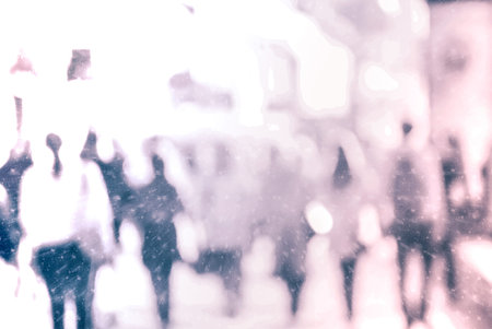 Winter city commuters with snow. Blurred image of peaople walking on the street. back home after...