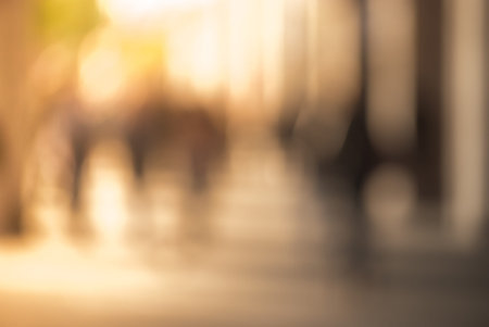People walking down the street in the evening, beautiful light at sunset. The photo is purposely...