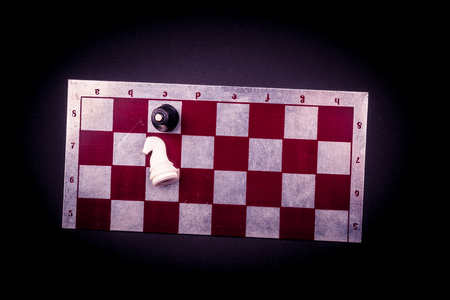 Chess board on dark background. Texture for gaming apps or web projects.の写真素材
