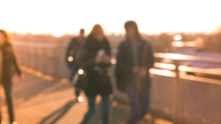 City commuters. Blurred image of workers going back home after work. Unrecognizable faces, bleached...