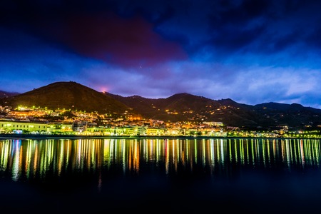 View on habour and old houses in Cefalu at night, Sicily. Beautiful townscape of old italian town. Travel photography.の写真素材